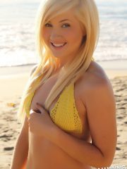 Stunning Alluring Vixen blonde Ashlee Madison shows off at the beach in a skimpy string bikini