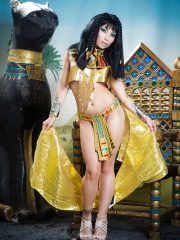 Brunette coed Rina Ellis freeing bare ass from Cleopatra outfit