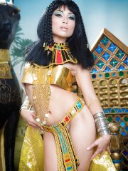 Brunette coed Rina Ellis freeing bare ass from Cleopatra outfit
