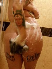 Taking a shower tattooed fatty Brianna Rose plays with her sexy flesh