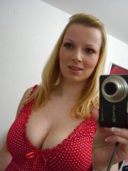 Busty blonde chick Ricky taking self shots in mirror while masturbating