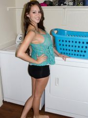 Amateur model Talia Shepard uncovers her knockers while doing laundry