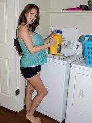 Amateur model Talia Shepard uncovers her knockers while doing laundry