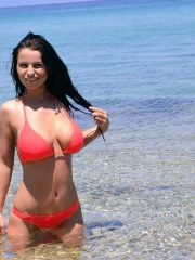 Sexy cam babe Busty Diane with big well-shaped tits posing outdoors in a tiny bikini
