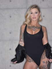 Elegant babe Kleio Valentien exposes her curvy tattooed body with big melons
